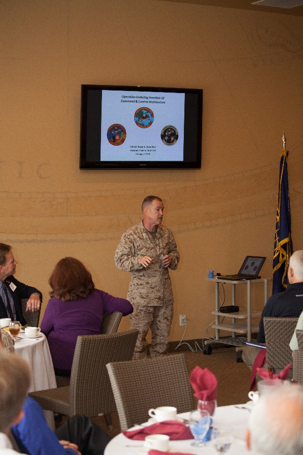 Col. Roger Standfield, USMC, assistant chief of staff G-6 for the 1st Marine Expeditionary Force, addresses luncheon guests in August.